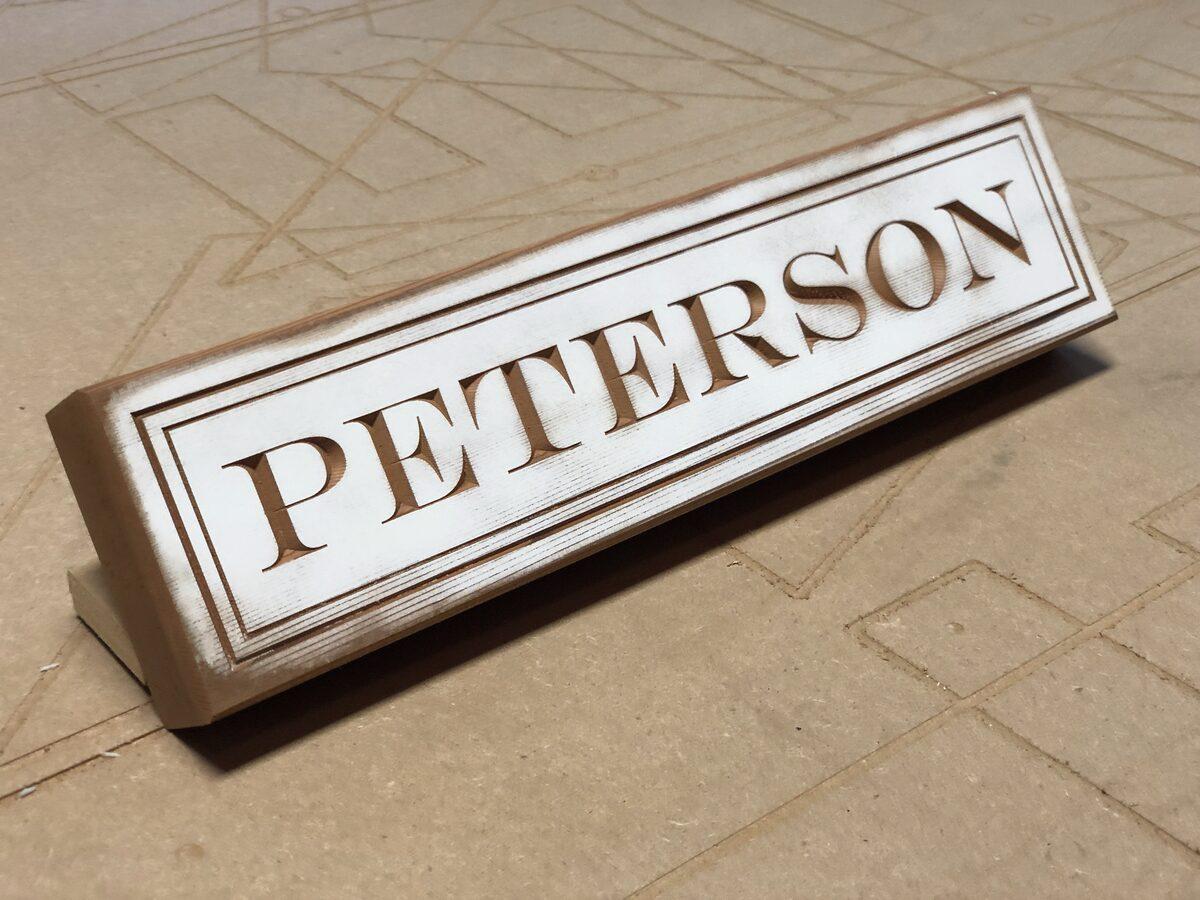 Carved cedar sign with engraved graphics and distressed paint finish — CG Signs Jacksonville FL
