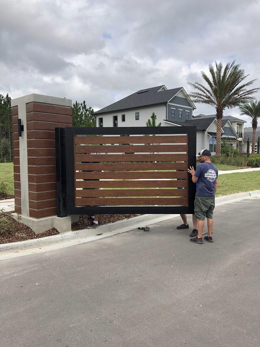 Fabricated aluminum gates with Knotwood slats for Edison by Toll Brothers at eTown, Jacksonville FL — by CG Signs