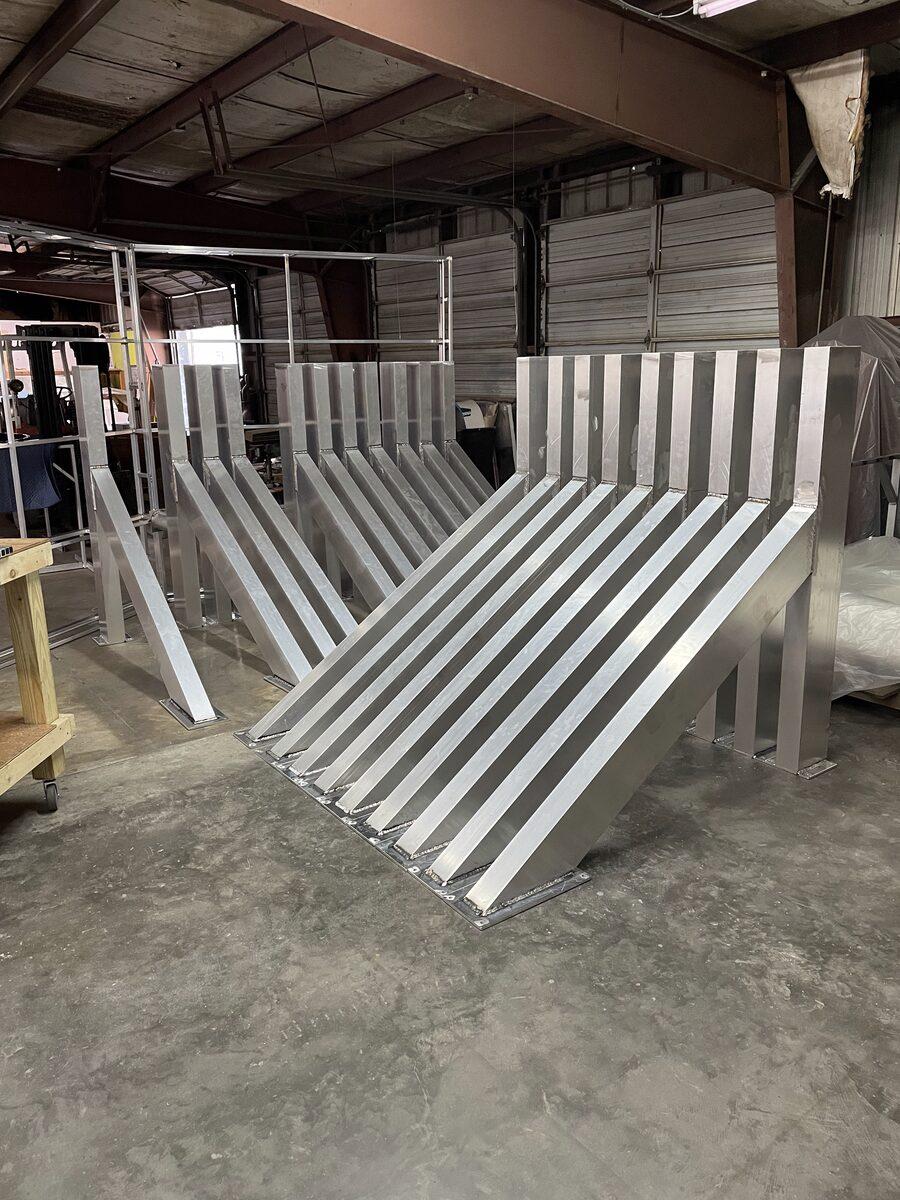 Custom fabricated aluminum trellis outriggers — CG Signs