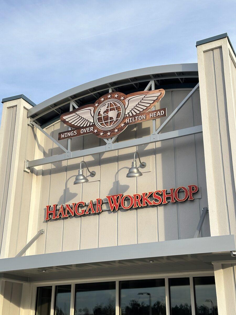 Custom HDU letters and sign panel attached to a fabricated aluminum bow string truss structure — CG Signs