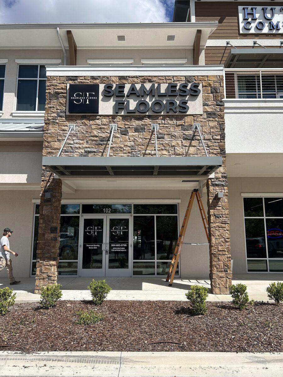 Flush mounted channel letters with day/night faces for Seamless Floors — Custom Graphics & Sign Designs