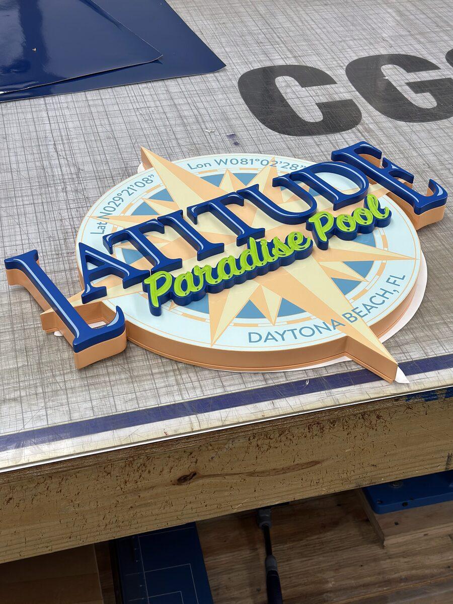 Multi-layer acrylic and HDU sign for Latitude Paradise Pool, Latitude Margaritaville — by CG Signs