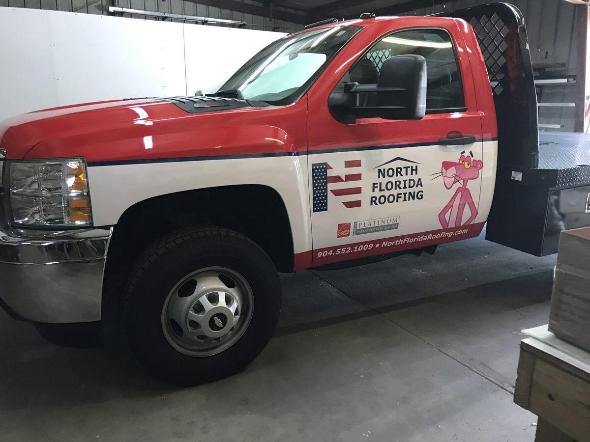 Partial wrap on Chevy Silverado for North Florida Roofing by CG Signs