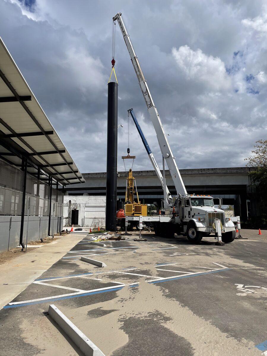 Installation of the steel support column at Dennis+Ives, Jacksonville FL — by CG Signs