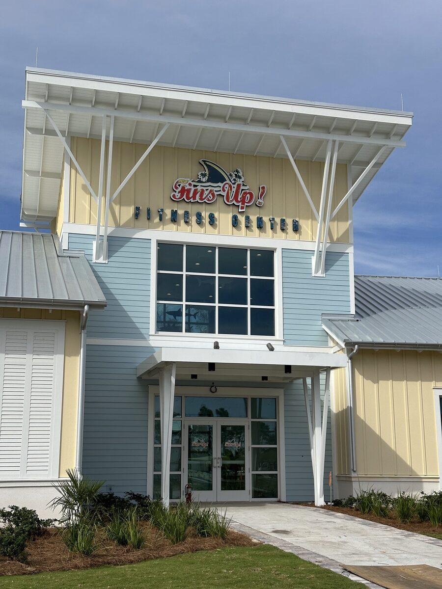 Fins Up Fitness Center entrance with rooftop dimensional sign — Latitude Margaritaville Watersound, FL — by CG Signs