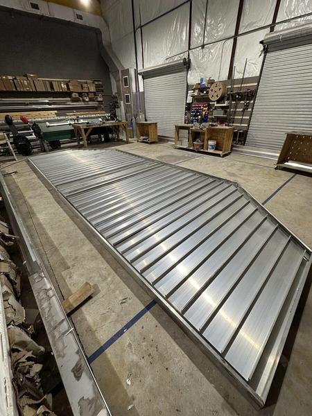 Fabrication of a large aluminum flat metal canopy used in the underside of a Marquee Sign — Custom Graphics & Sign Designs
