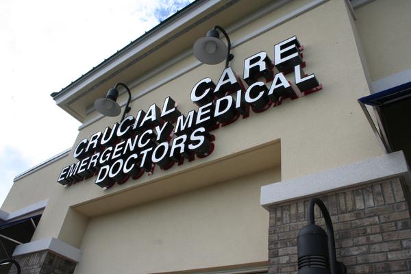 Channel letters with custom individual letter backplates in a contrasting color for Crucial Care Emergency Medical Doctors — Custom Graphics & Sign Designs, Jacksonville FL
