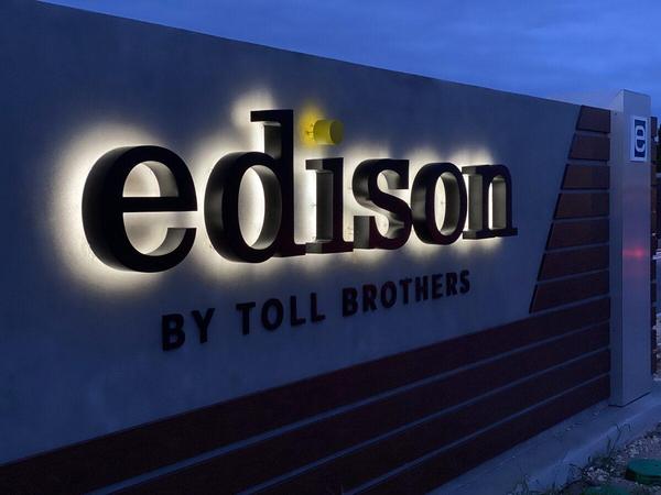 Night view of the halo-lit channel letters for Edison by Toll Brothers in eTown — Custom Graphics & Sign Designs