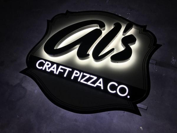 Fabricated custom shaped panel with halo-lit aluminum channel letters and push through acrylic letters for Al's — Custom Graphics & Sign Designs, Jacksonville FL