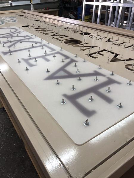 View of the inside of a sign cabinet with push throuh acrylic letters — Custom Graphics & Sign Designs, Orange Park FL