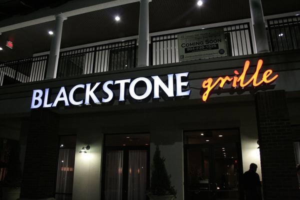 Illuminated channel letters with custom orange script for Blackstone Grille — Custom Graphics & Sign Designs, Jacksonville FL
